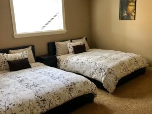 Guest bedroom with 2 beds in this rental home