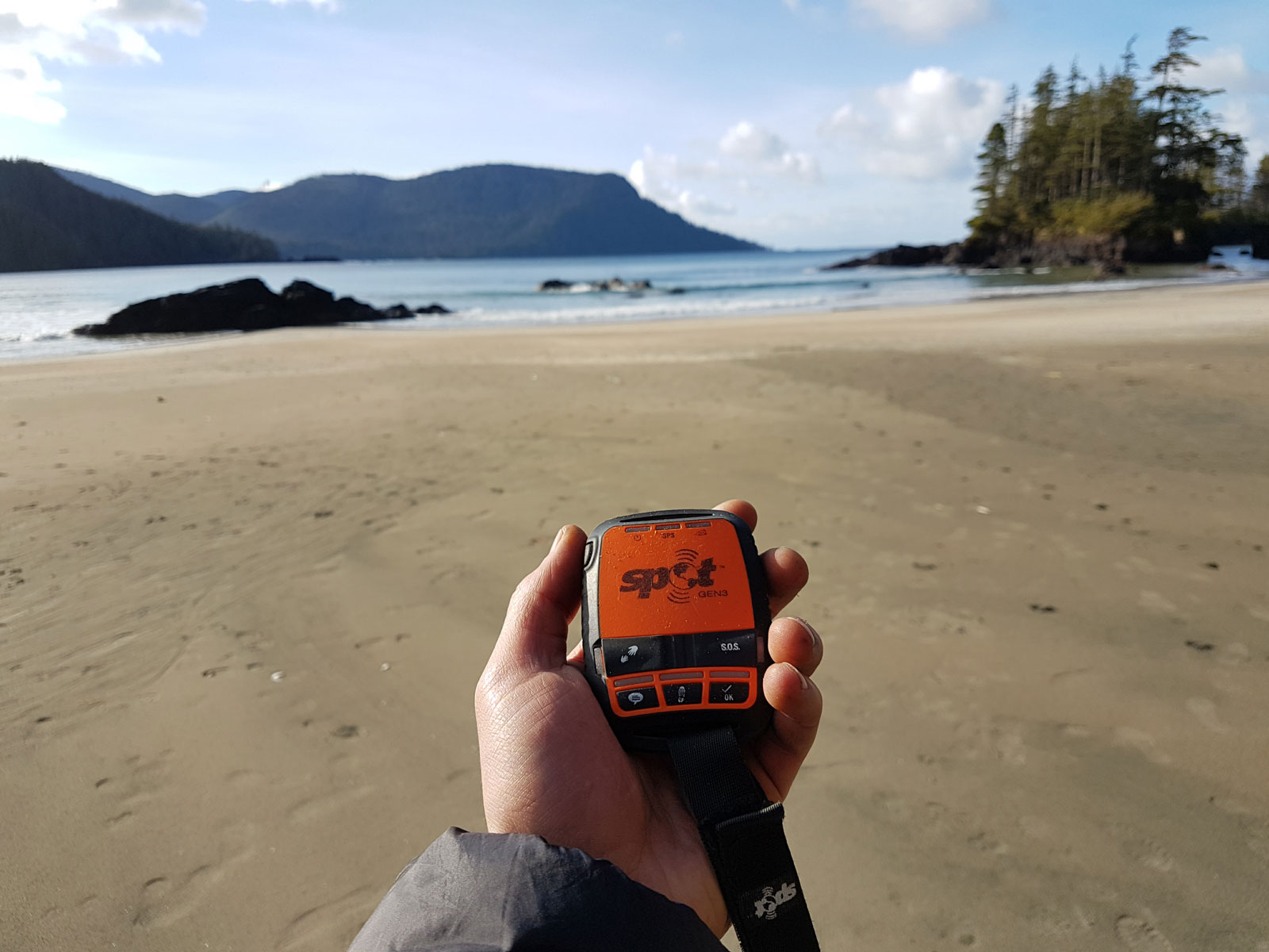 Vancouver Island beach with hand holding compass